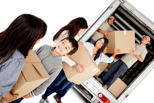 Removal van and moving boxes in a Stockwell residential street