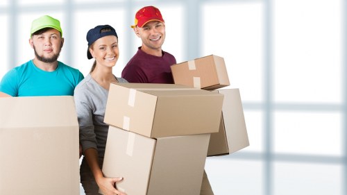 Careful unloading of boxes and furniture at a Stockwell property