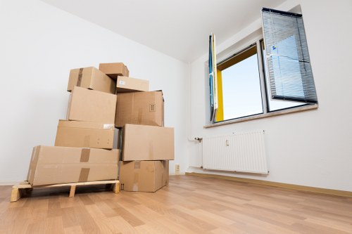 Boxes and furniture being sorted for reuse, recycling, and responsible disposal